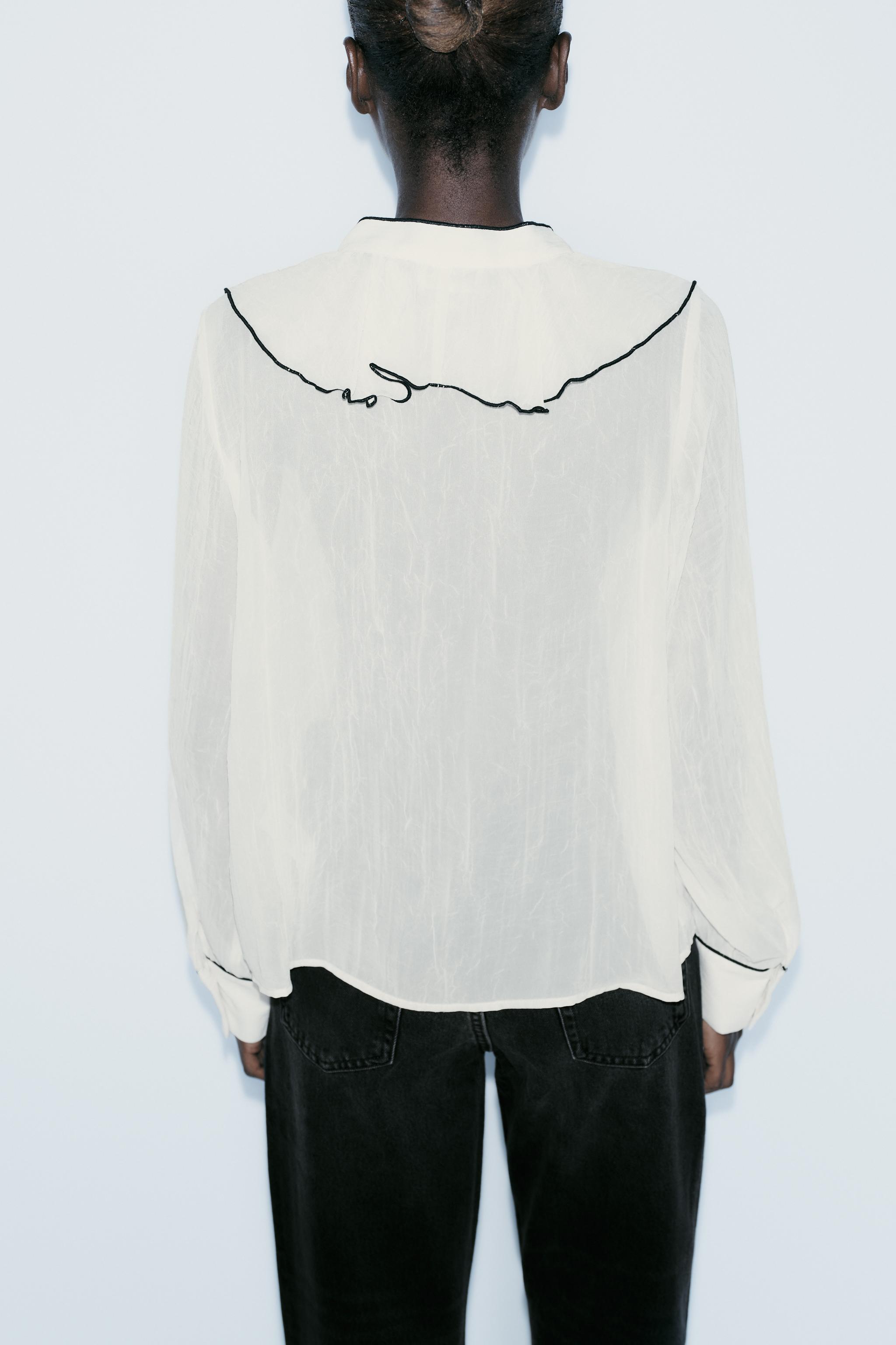 RUFFLED BLOUSE WITH CONTRAST PIPING