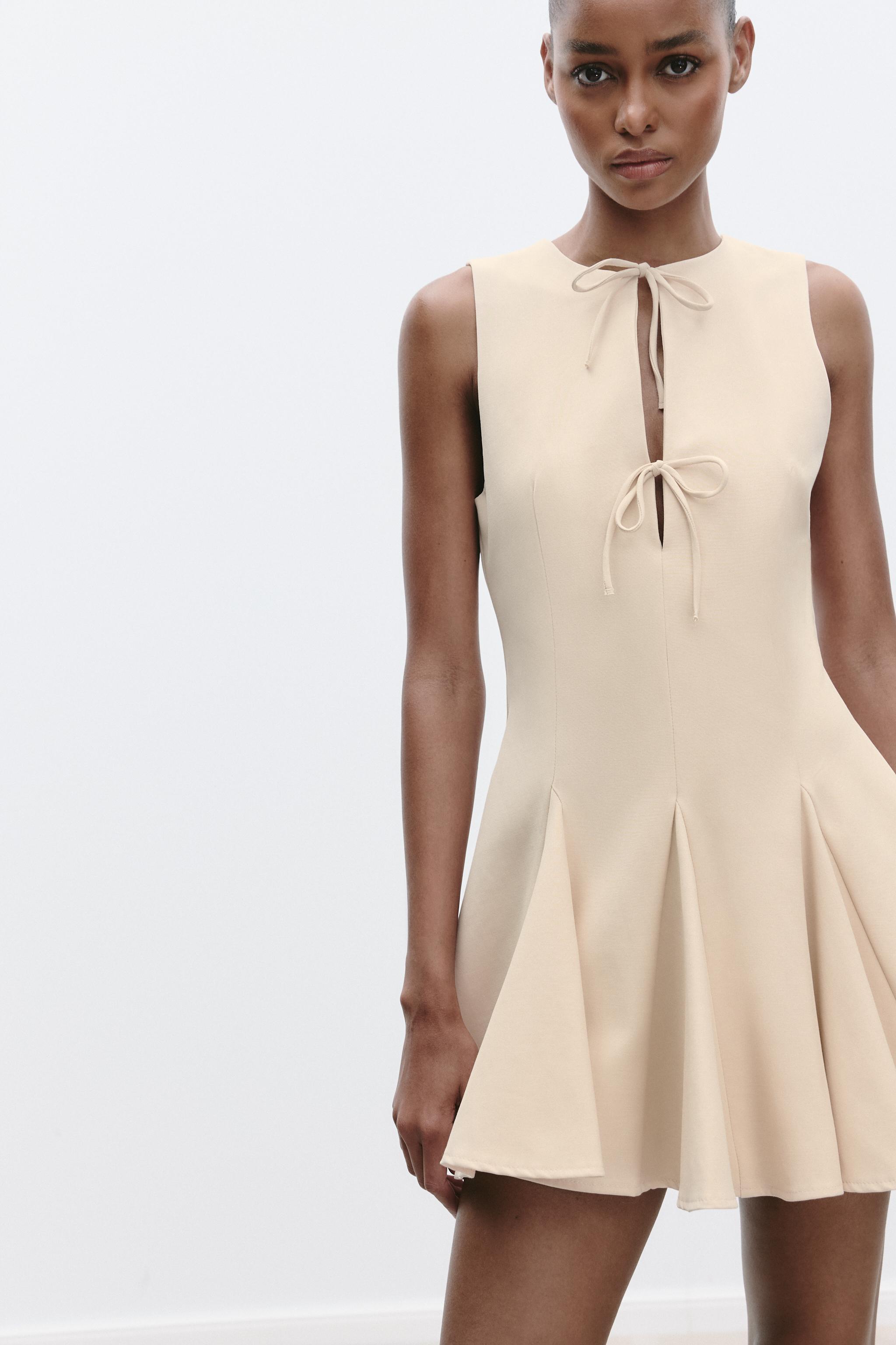 SHORT DRESS WITH BOWS AND GODET HEM
