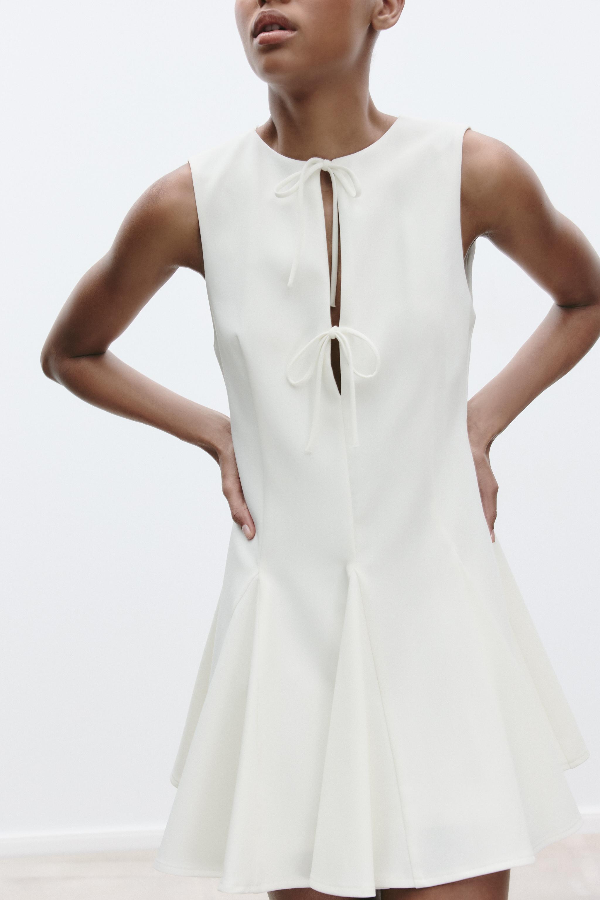SHORT DRESS WITH BOWS AND GODET HEM