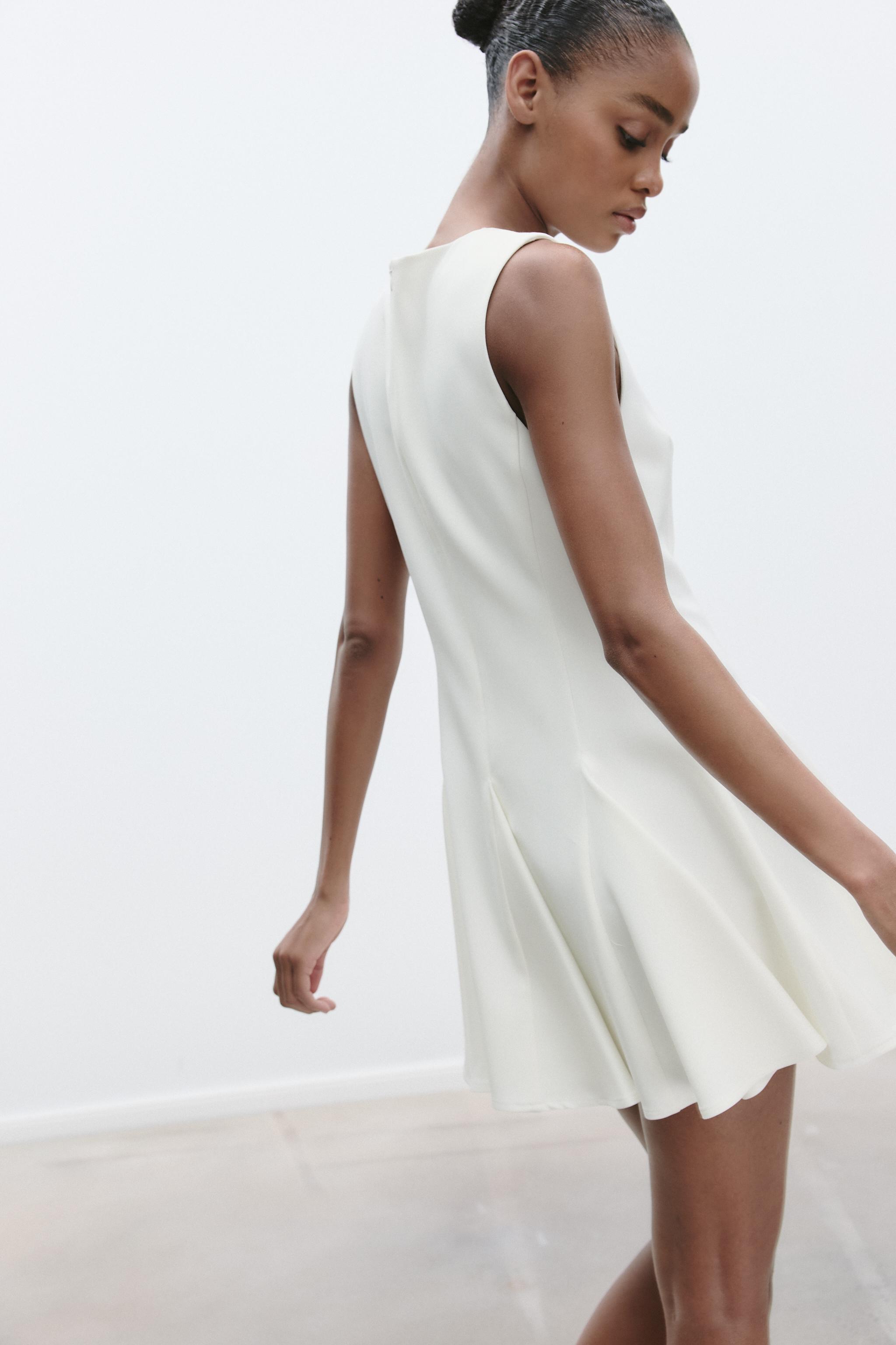 SHORT DRESS WITH BOWS AND GODET HEM
