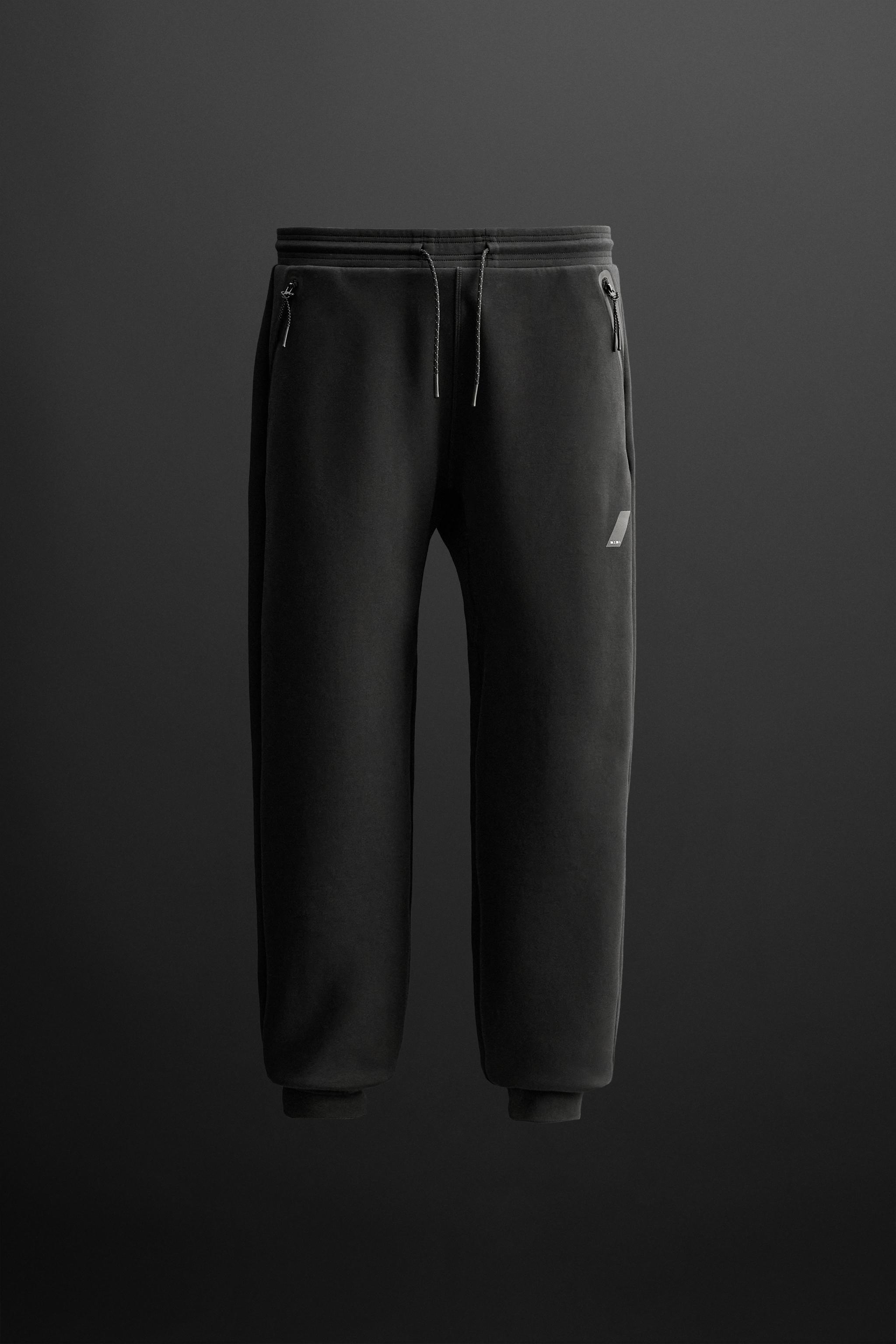 TECHNICAL JOGGERS WITH ZIPS